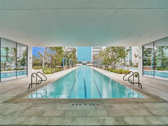 view of swimming pool with a patio