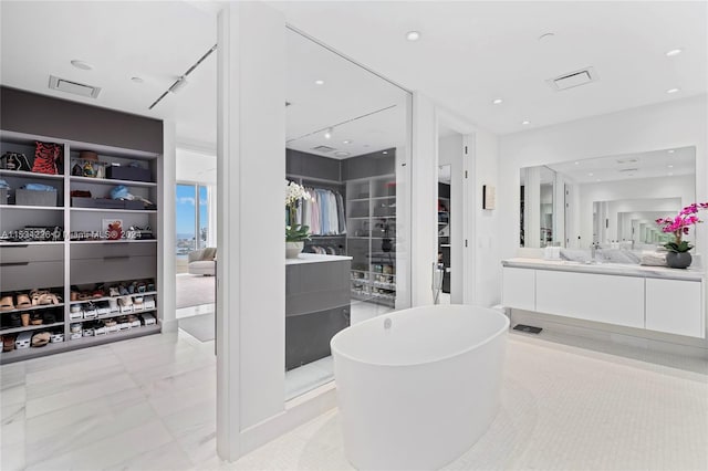 bathroom featuring vanity and a bathing tub