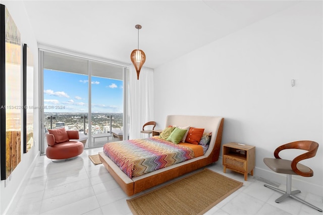 bedroom featuring access to exterior, light tile patterned flooring, and expansive windows