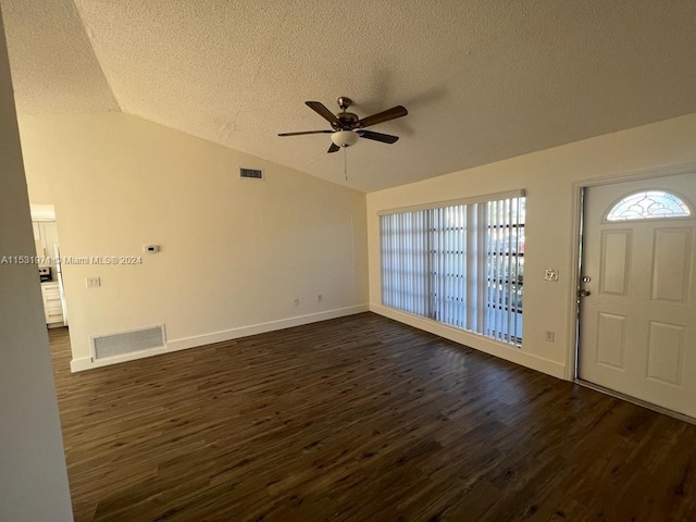 foyer featuring lofted ceiling, a textured ceiling, ceiling fan, and dark hardwood / wood-style floors