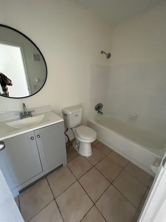 full bathroom with vanity, tile floors, toilet, and tub / shower combination