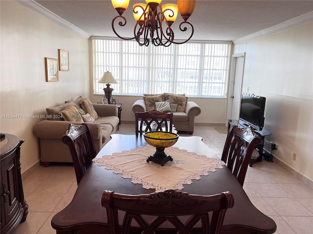 dining space featuring crown molding, an inviting chandelier, and light tile flooring