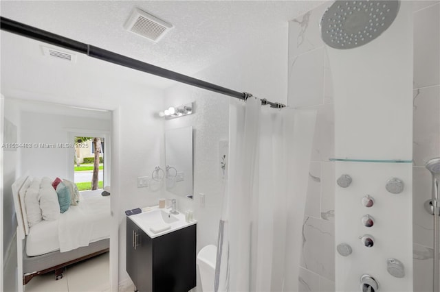 bathroom featuring a textured ceiling, vanity, and shower / bath combination with curtain