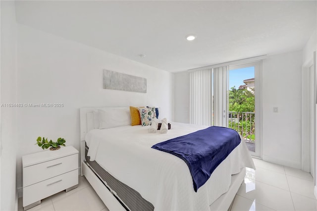 bedroom featuring access to exterior and light tile patterned floors