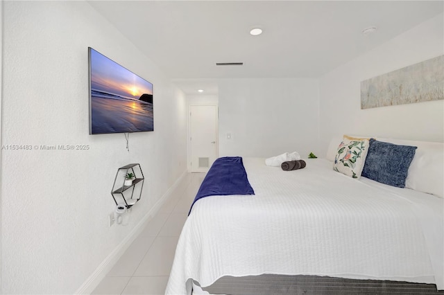 bedroom with light tile patterned floors