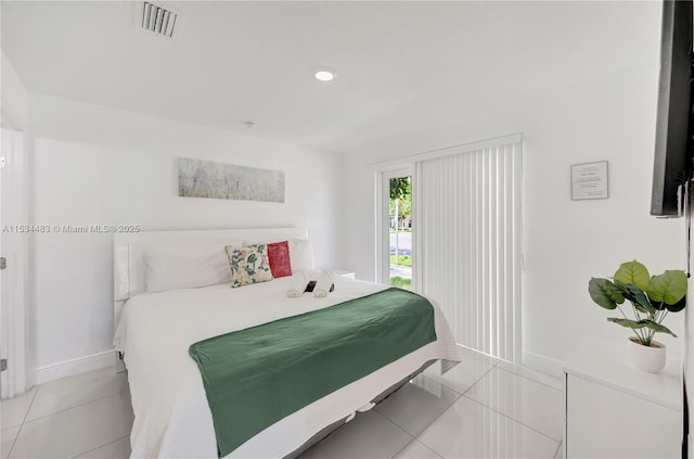 bedroom featuring light tile patterned flooring