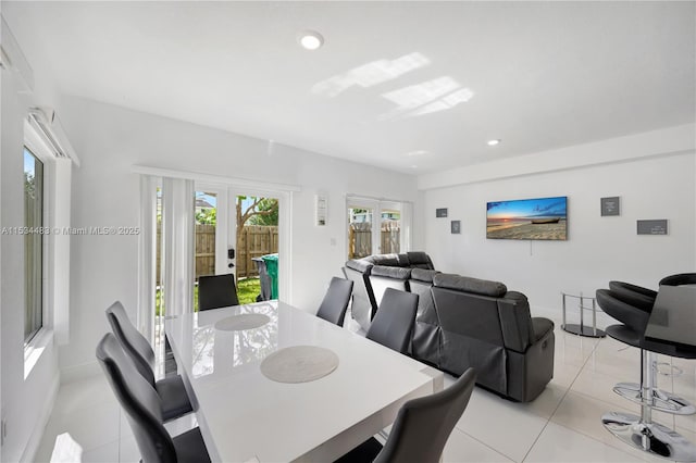 dining room with light tile patterned floors and french doors