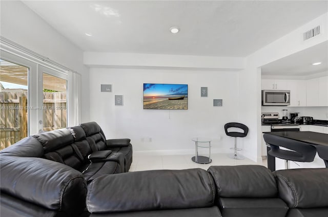 living room with light tile patterned floors