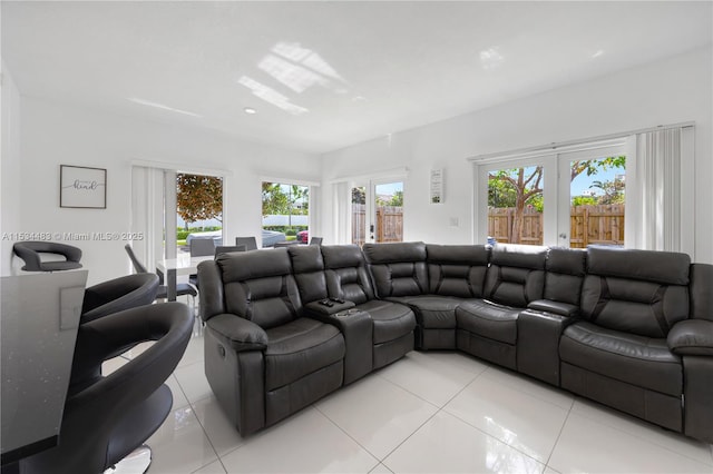 living room with light tile patterned floors and french doors