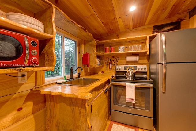 kitchen with wood counters, appliances with stainless steel finishes, wooden ceiling, and sink