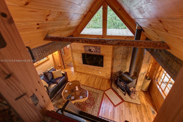 living room with hardwood / wood-style floors, lofted ceiling, and wood ceiling