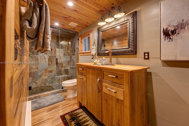 bathroom featuring hardwood / wood-style floors, vanity, wooden ceiling, toilet, and an enclosed shower