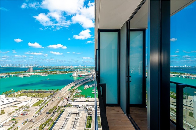 balcony featuring a water view