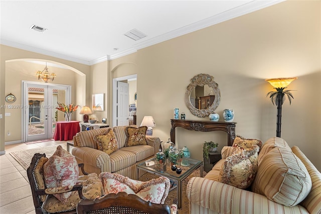 tiled living room featuring a notable chandelier, french doors, and ornamental molding