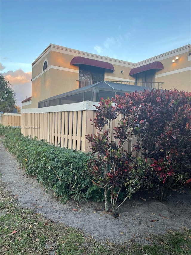 view of property exterior at dusk