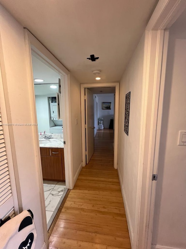 hall with light hardwood / wood-style floors