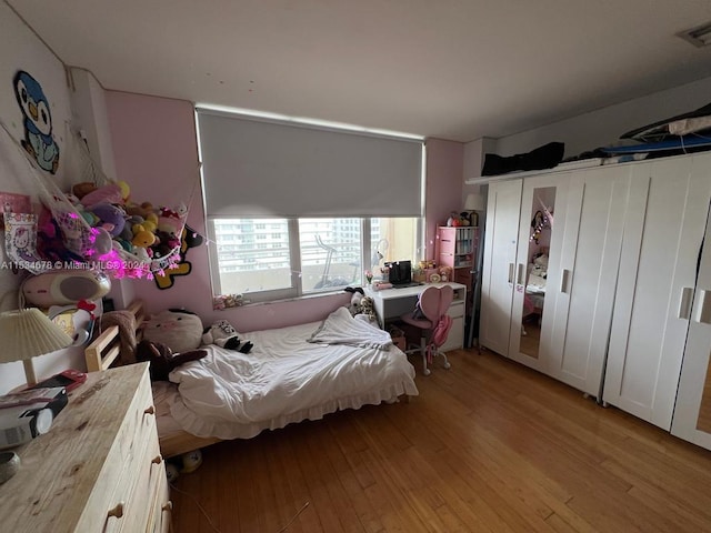 bedroom featuring light hardwood / wood-style floors