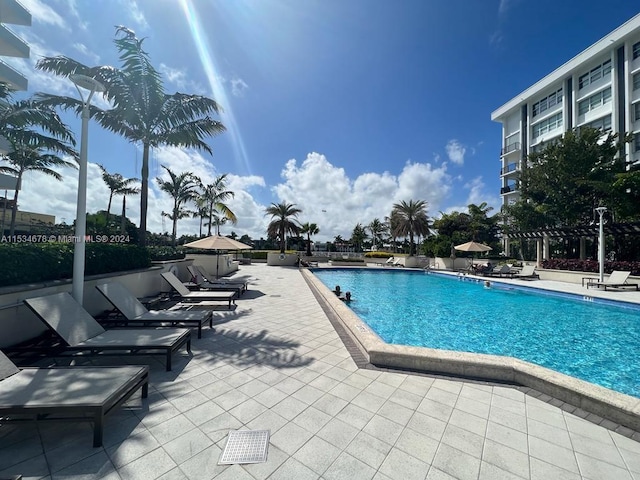 view of swimming pool with a patio