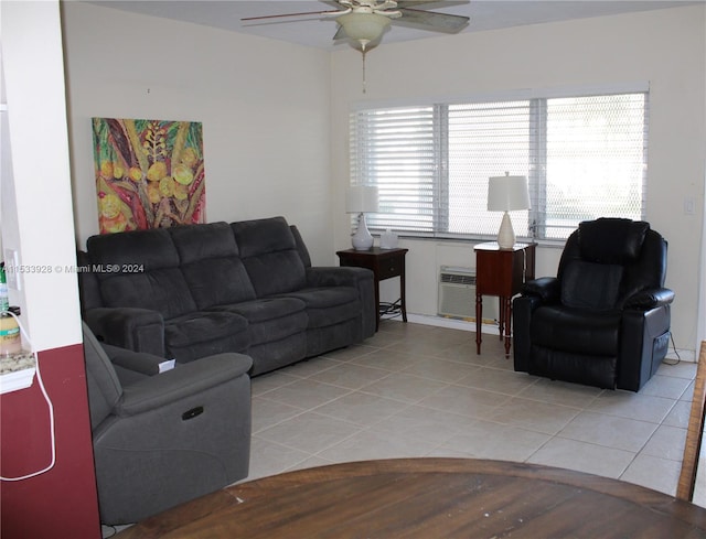 tiled living room with an AC wall unit and ceiling fan