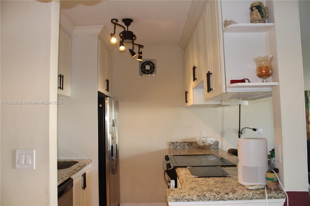 kitchen featuring white cabinetry, light stone counters, and stainless steel appliances