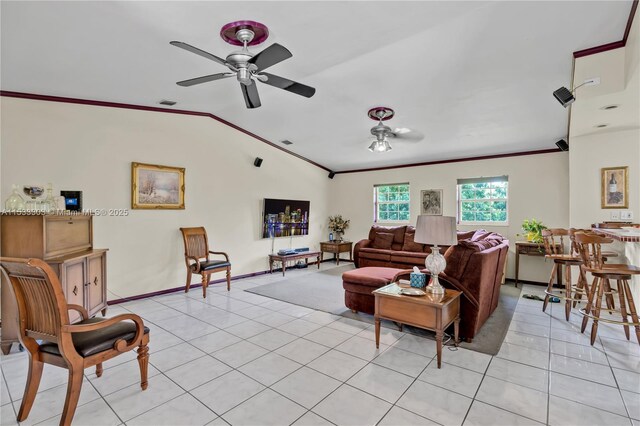 tiled living room featuring ceiling fan, ornamental molding, and lofted ceiling