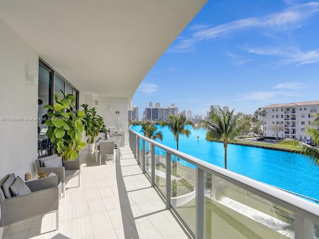 balcony featuring a water view