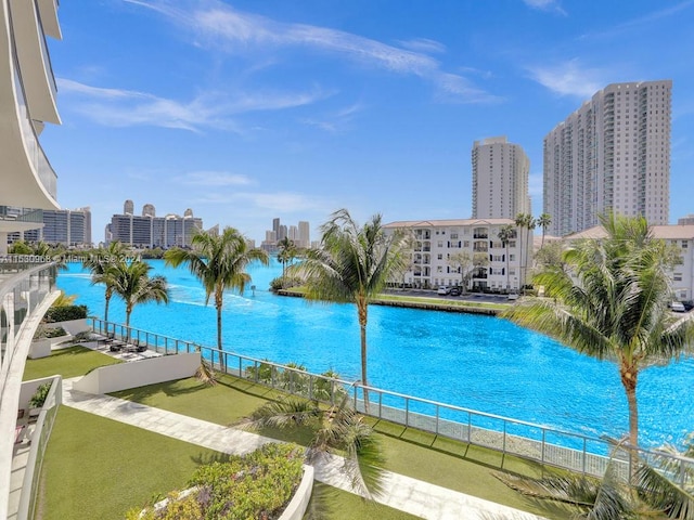 view of swimming pool with a water view