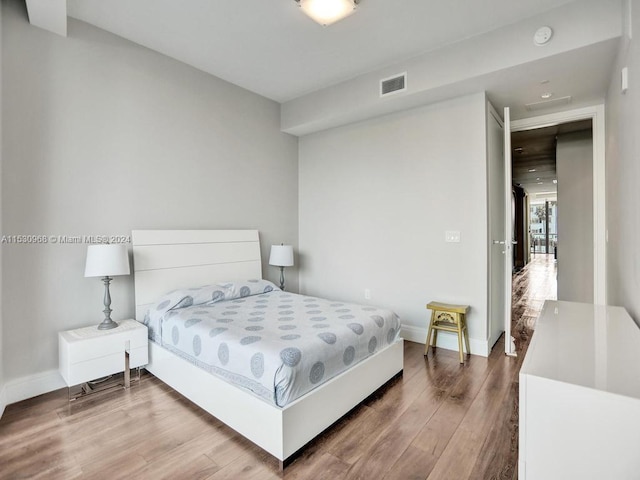 bedroom featuring wood-type flooring