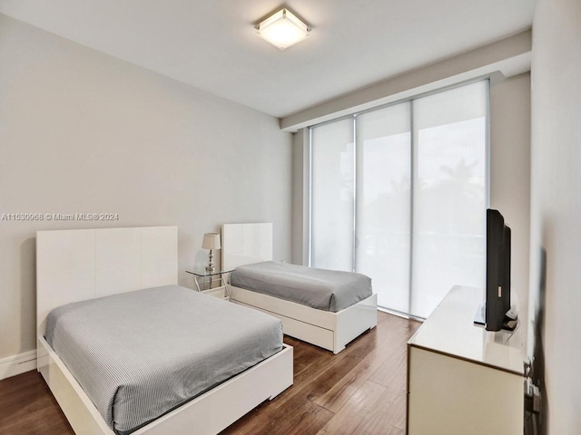 bedroom featuring dark hardwood / wood-style flooring