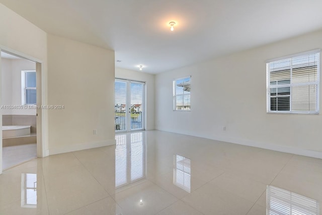 empty room with light tile floors