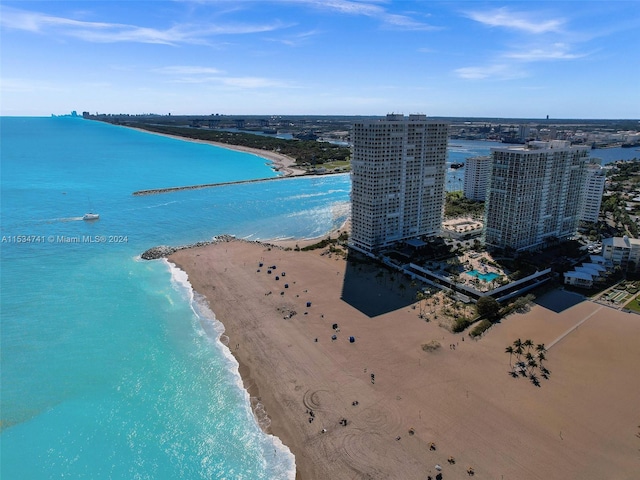 drone / aerial view with a water view and a view of the beach