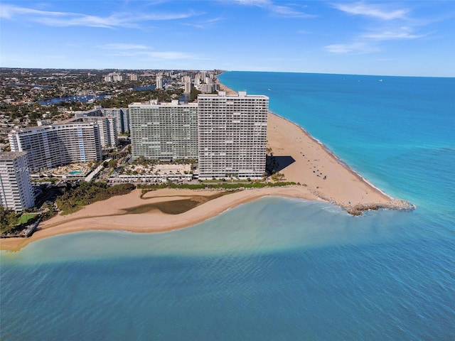 drone / aerial view with a beach view and a water view