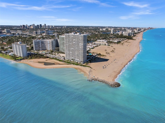 aerial view with a water view and a beach view