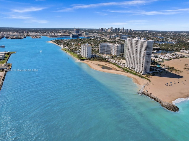 bird's eye view featuring a water view and a beach view