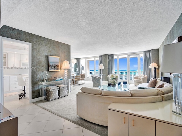 tiled living room featuring a textured ceiling