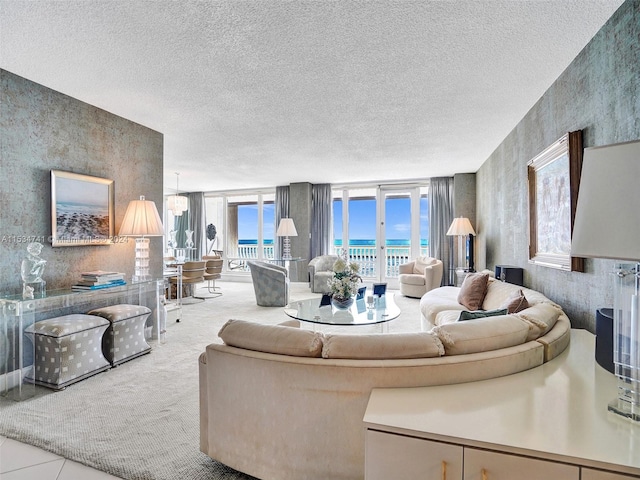 living room with light carpet and a textured ceiling