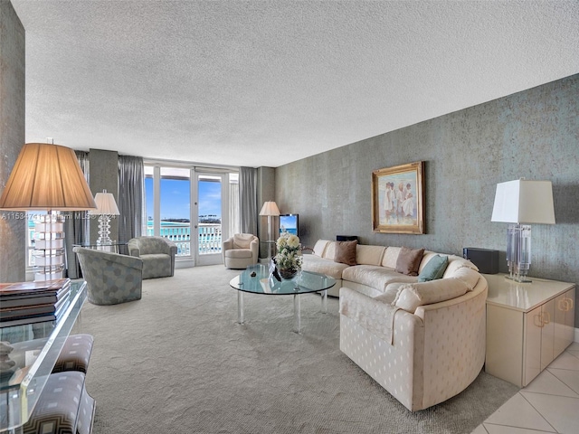 living room featuring light carpet, a textured ceiling, and french doors