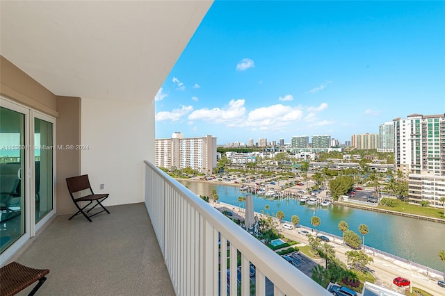 balcony featuring a water view