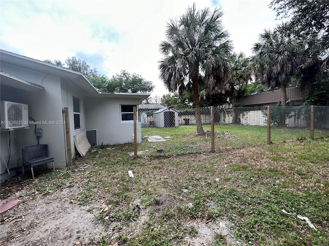 view of yard featuring a storage unit