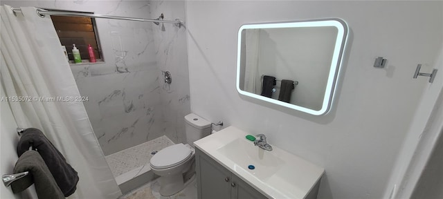 bathroom featuring vanity, walk in shower, and toilet