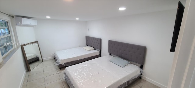 bedroom featuring light tile floors and a wall mounted AC