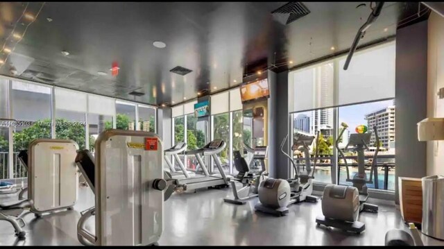 gym featuring floor to ceiling windows