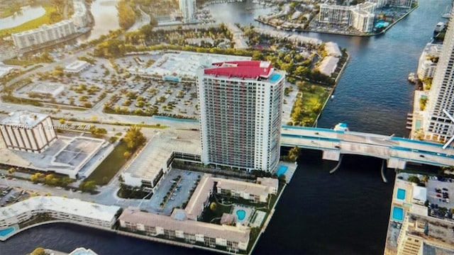 birds eye view of property with a water view