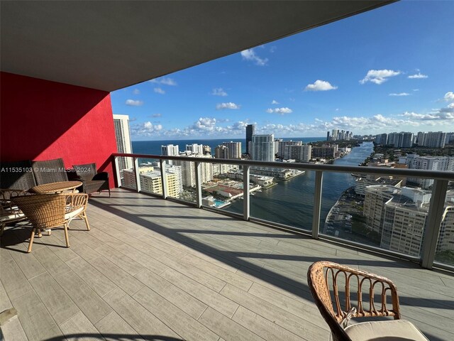 balcony featuring a water view