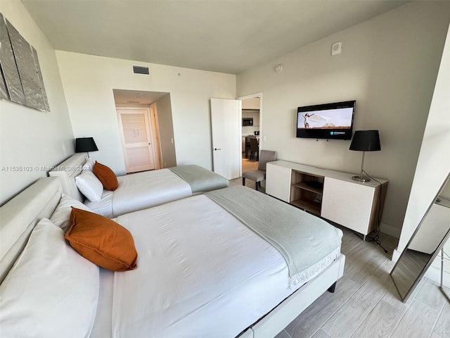 bedroom with light wood-type flooring