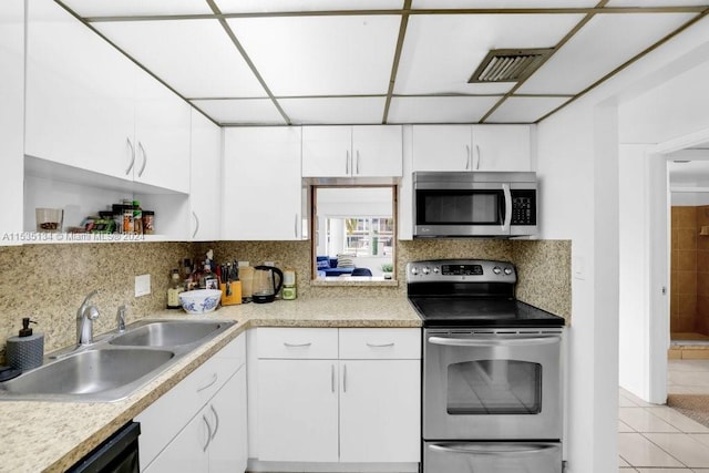 kitchen featuring sink, white cabinets, and appliances with stainless steel finishes