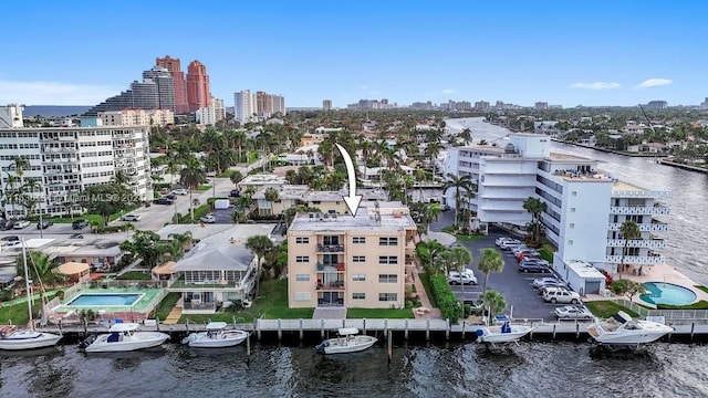 birds eye view of property with a water view