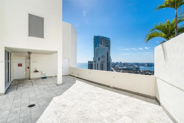 view of patio / terrace with a water view