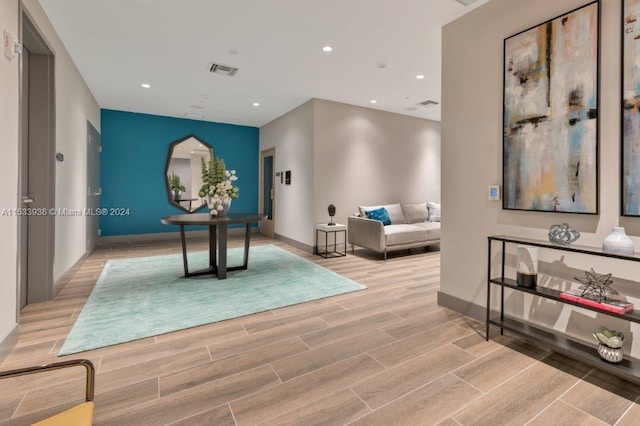 playroom with light hardwood / wood-style floors