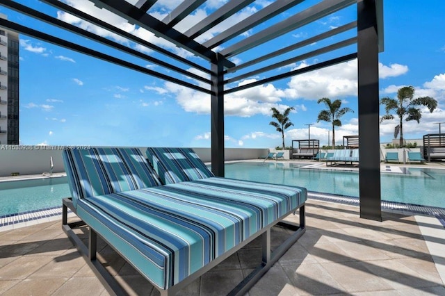 view of patio / terrace featuring a pergola and a community pool